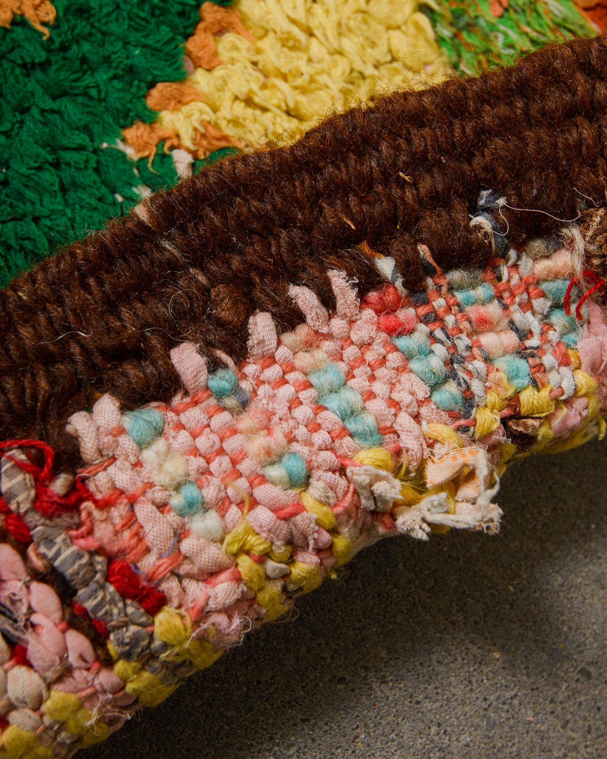 Edge of rug showing hole.